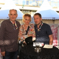 Competition Programme - Documentary Film Jury members Boro Kontić (Director of the Media Center in Sarajevo), Anka Schmid (Filmmaker, videoartist) and Juliano Ribeiro Salgado (Director/writer) at Festival reception, Festival Square, 21. Sarajevo Film Festival, 2015 (C) Obala Art Centar