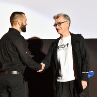 Moderator Nebojša Jovanović and Wim Wenders, screening of Paris, Texas, Tribute To, Coca-Cola Open Air Cinema, 27th Sarajevo Film Festival, 2021 (C) Obala Art Centar	
